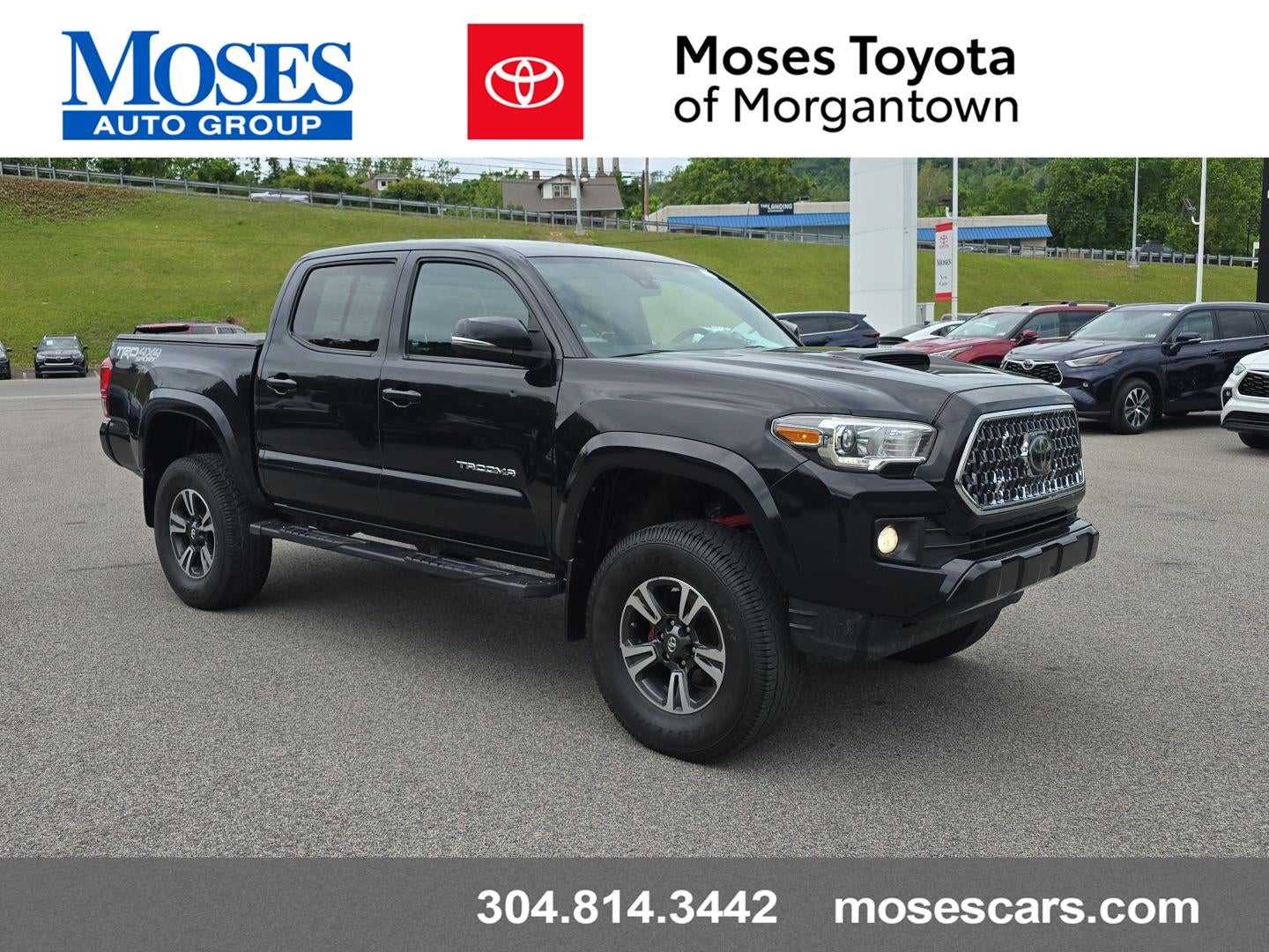 2019 Toyota Tacoma TRD Sport in Midnight Black Metallic — front three-quarter view